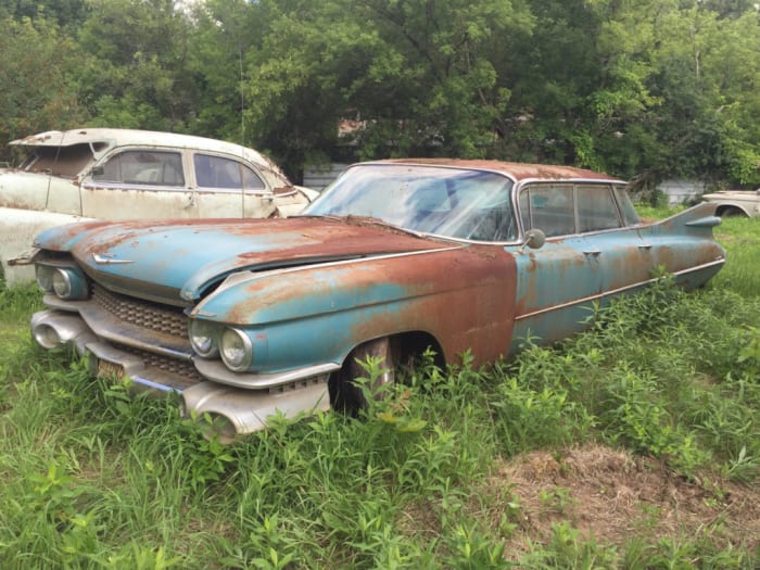  There are two 1959 Cadillac Sedans deVille, one of each variety. This "flat top" Sedan deVille is in about the same shape as the "six window" Sedan deVille in the sale, but someone chromed some of the engine components on this flat top's 390 V-8. Between the flat top styling and chrome-plated engine parts, this one fetched the higher bid of $4200; the other Sedan deVille fetched $3200.