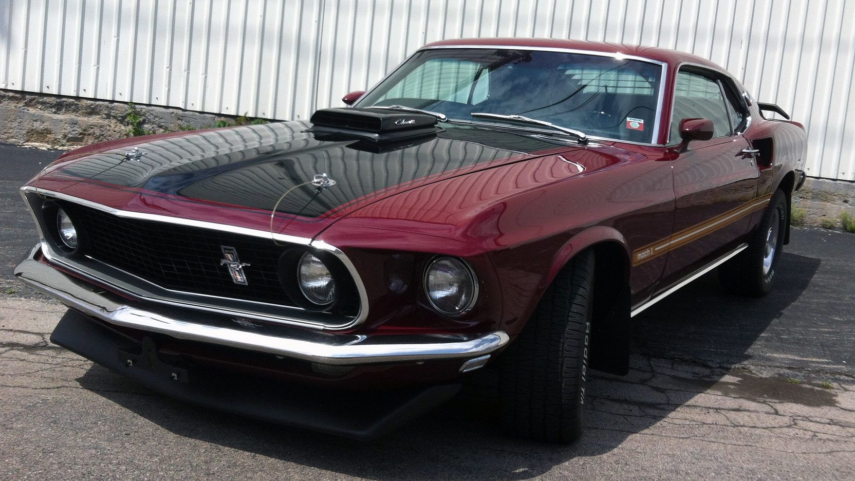 A parked 1969 Ford Mustang Mach I Cobra Jet