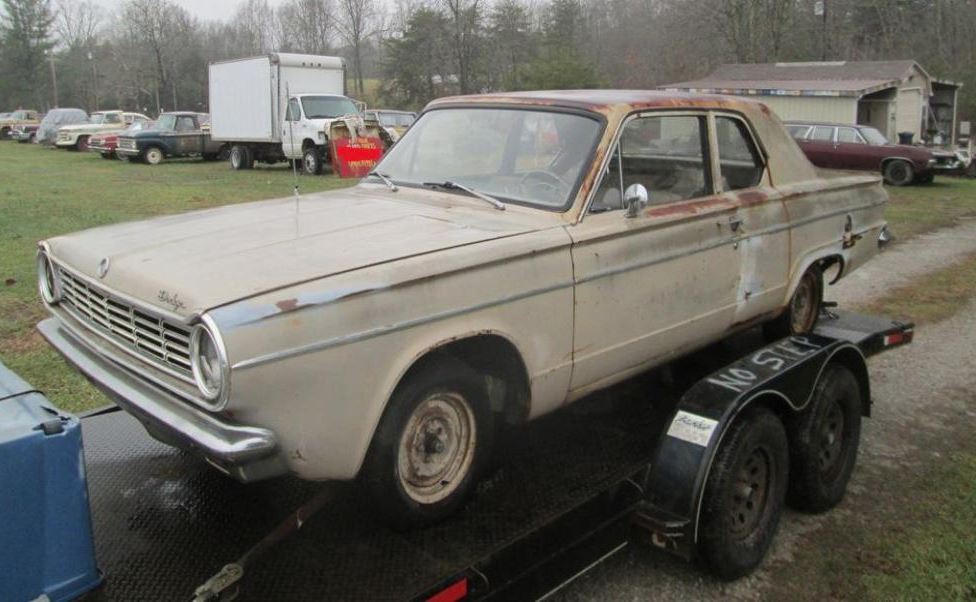 Curiosity piqued, she decided to investigate and found the dusty, abandoned shell of a 1965 Dodge Dart hidden beneath layers of dust and decay.