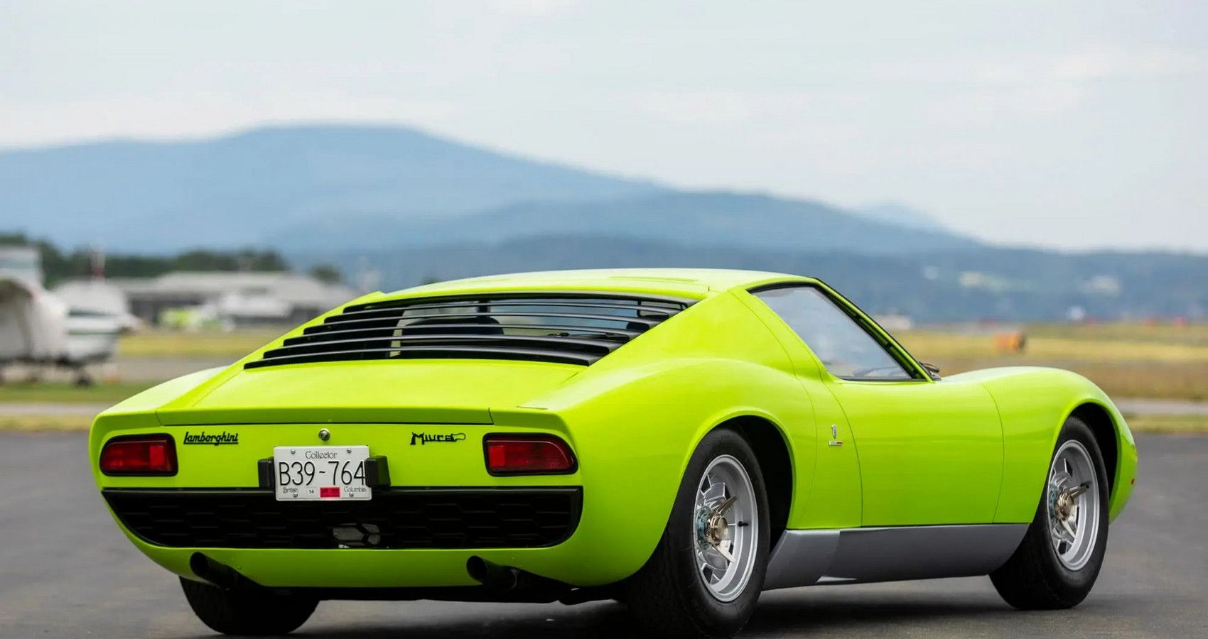 Green Lamborghini Miura P400 on the road