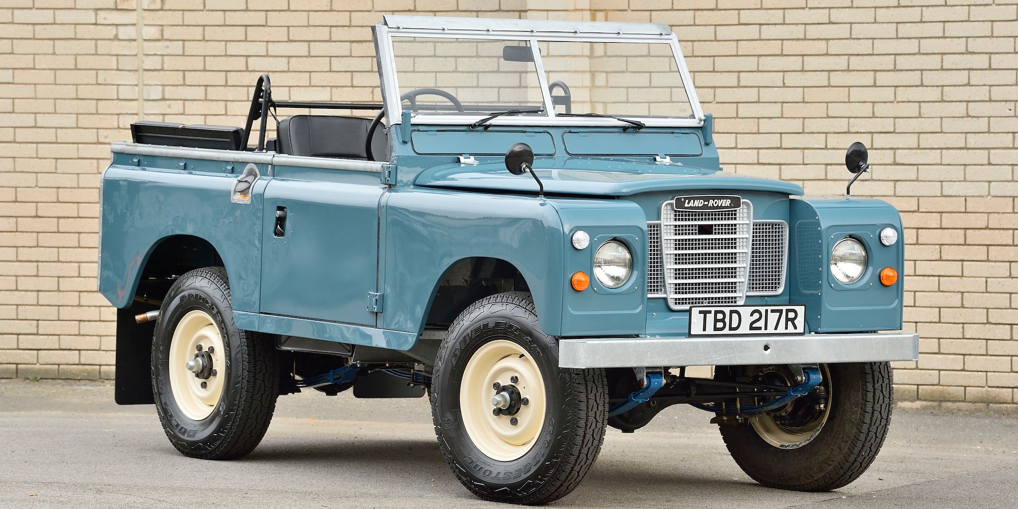 A blue Series III Land Rover convertible