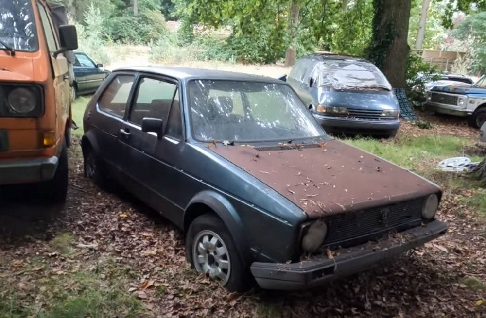 A Volkswagen GTi Mark I amid the other vehicles at a hidden UK mansion